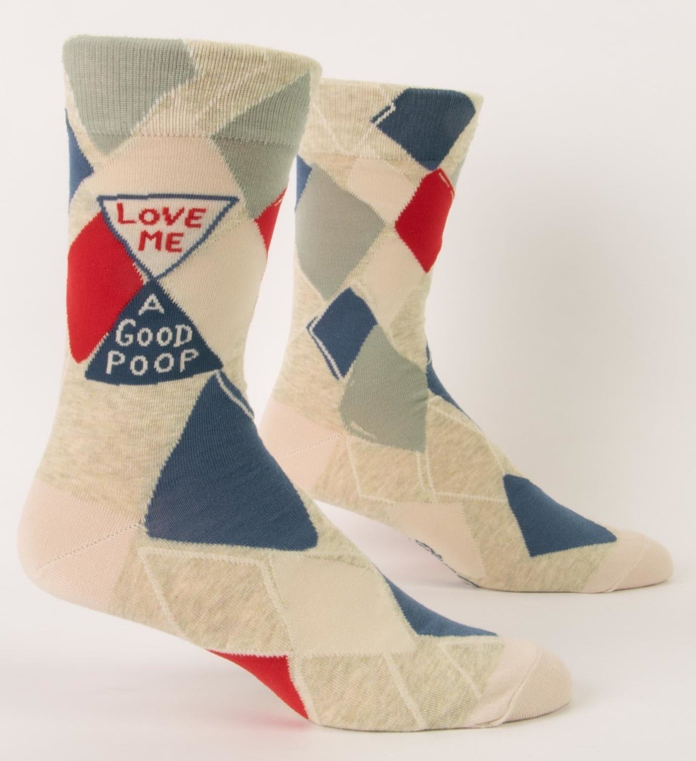 a pair of beige socks with a multicolored, red, little green and slate blue diamond pattern, and small text that reads love me a good poop
