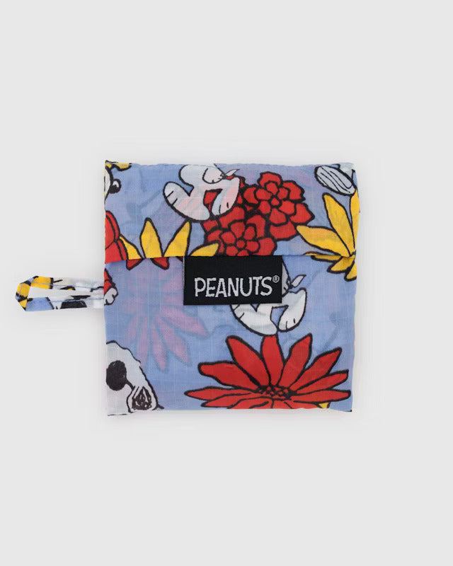 A blue canvas pouch with red and yellow flowers and multiple depictions of Snoopy wearing sunglasses, red hats and/or red coats. A black tag reads 