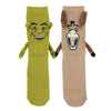 A pair of socks, one that looks like Shrek and one that looks like Donkey, with 3D arms and magnetic hands