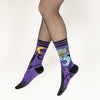 A model in fishnet tights wear the Cheshire cat socks showing off both sides of the wrap around design.