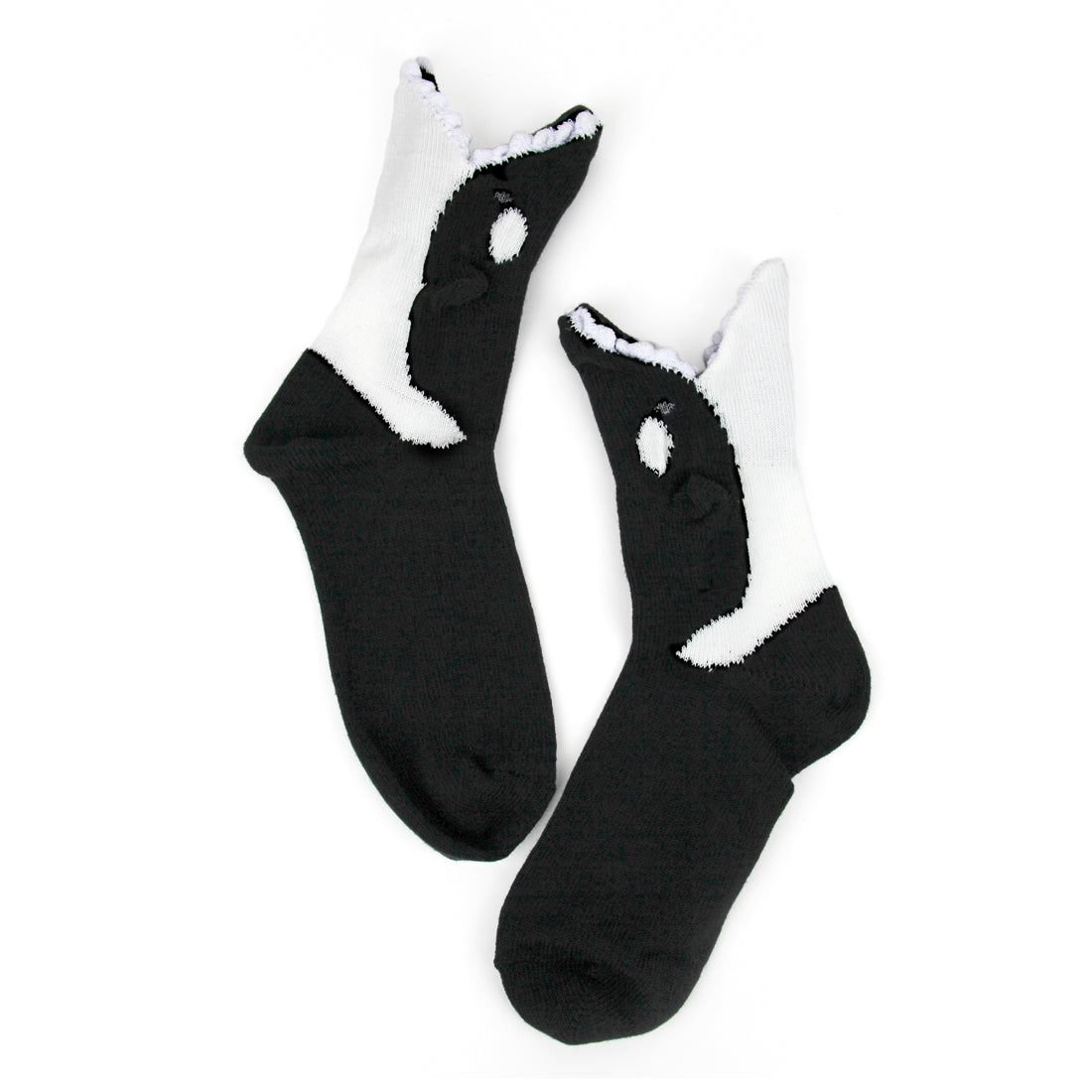 A white background shows two crew socks in flatlay. The feet are completely black and the ankles are styled like two 3D orcas with their mouths at the top of the socks.