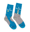 Shown in a flatlay, a pair of Out of Print brand unisex cotton crew socks in blue and grey. These socks feature a little cartoon boy outside at night with the words, "Le Petit Prince" on the leg. The image is take from the 1943 classic children's novella The Little Prince written and illustrated by Antonie de Saint-Exupery.