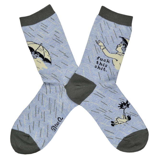 Shown in a flatlay, a pair of women's Blue Q brand combed cotton crew socks in blue with a grey heel, toe, and cuff and a cartoon women with an umbrella. The leg features the phrase, 