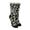 Shown on leg forms, a pair of women's Blue Q socks in grey with a cream colored cuff. The sock has an all over motif of abstract floral vines in cream with a heart in the center of the leg of the sock that reads, "I made a good kid".