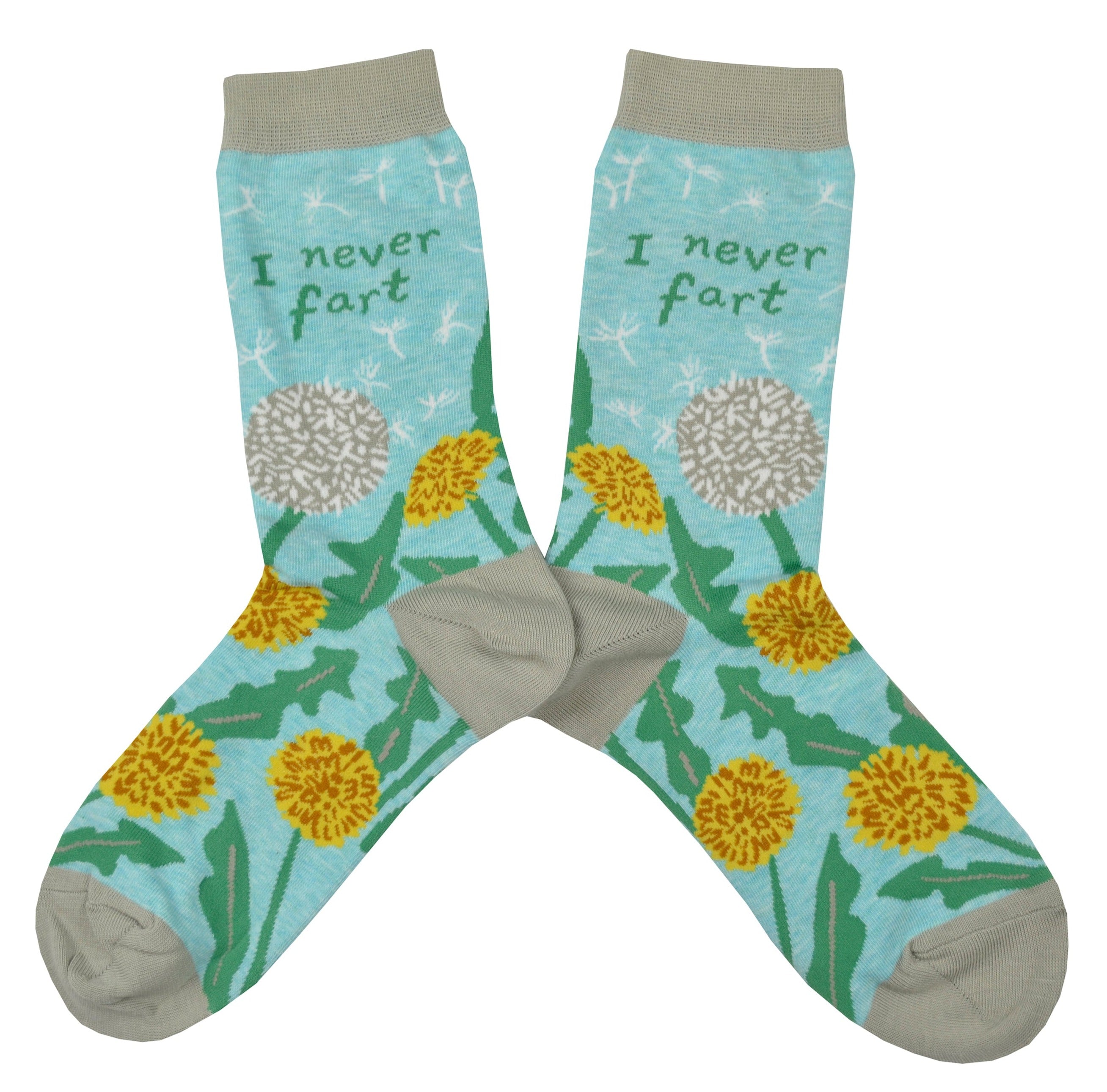 Shown in a flatlay, a pair of light blue Blue Q socks with a grey heel, toe, and cuff. They feature a dandelion and puffball design on the foot with the words, 