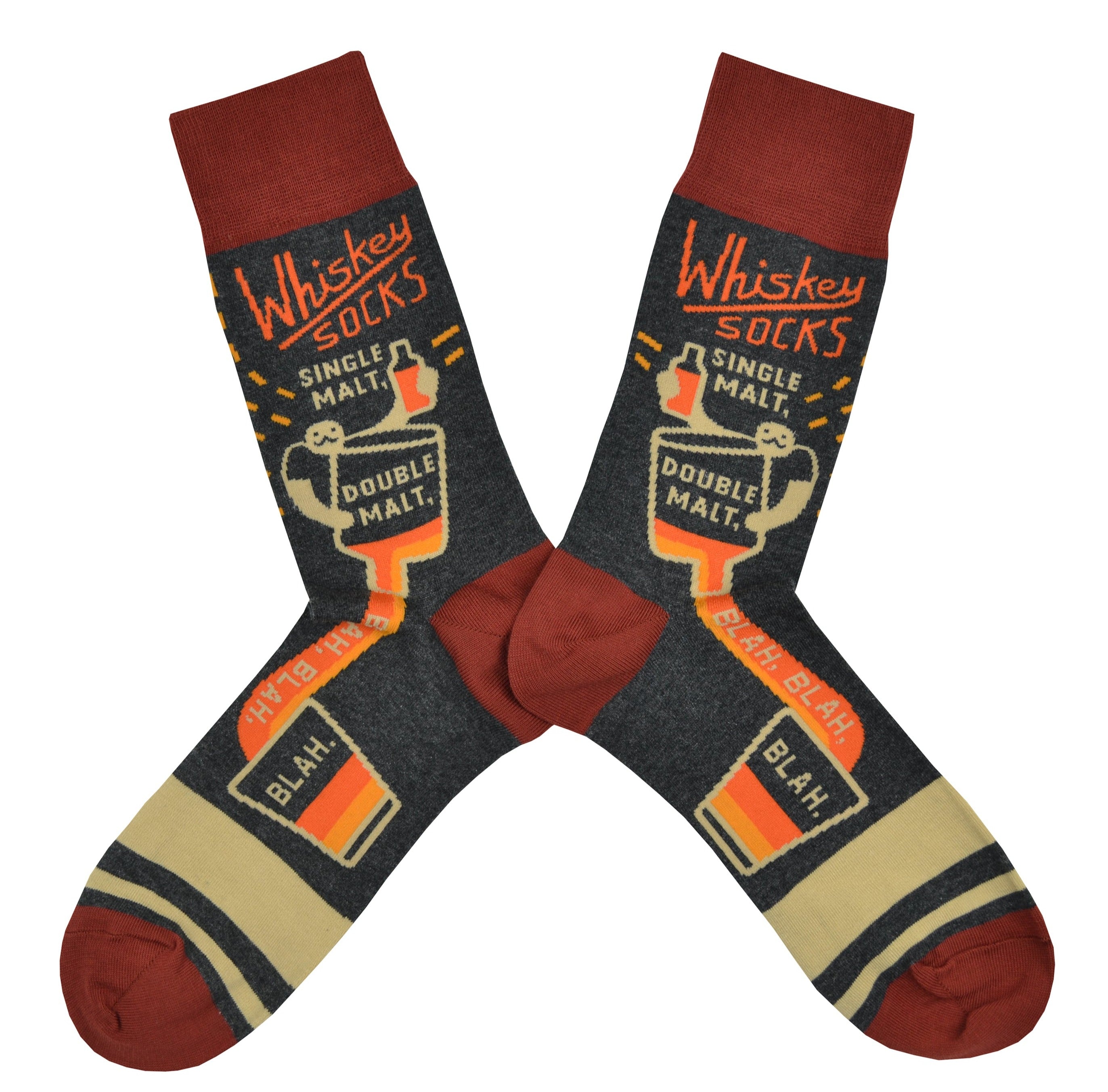Shown in a flatlay, a pair of Blue Q brand men's cotton crew socks in grey with 2 tan stripes on the foot and brick red cuff/heel/toe. These socks feature a mustachioed man pouring a whiskey that flows down the foot of the sock. The words, 