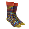 Shown on a leg form, these blue, yellow, orange, brown and gray thinly striped men's novelty crew socks with an orange cuff by the brand Blue Q feature the words "Pretty Decent Boyfriend" on the leg.