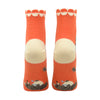 Shown on foot forms from the back, a pair of women's Blue Q cotton ankle socks in orange with a cream heel, toe, and cuff. The sole of the sock features a mini wolf man cartoon on the foot.