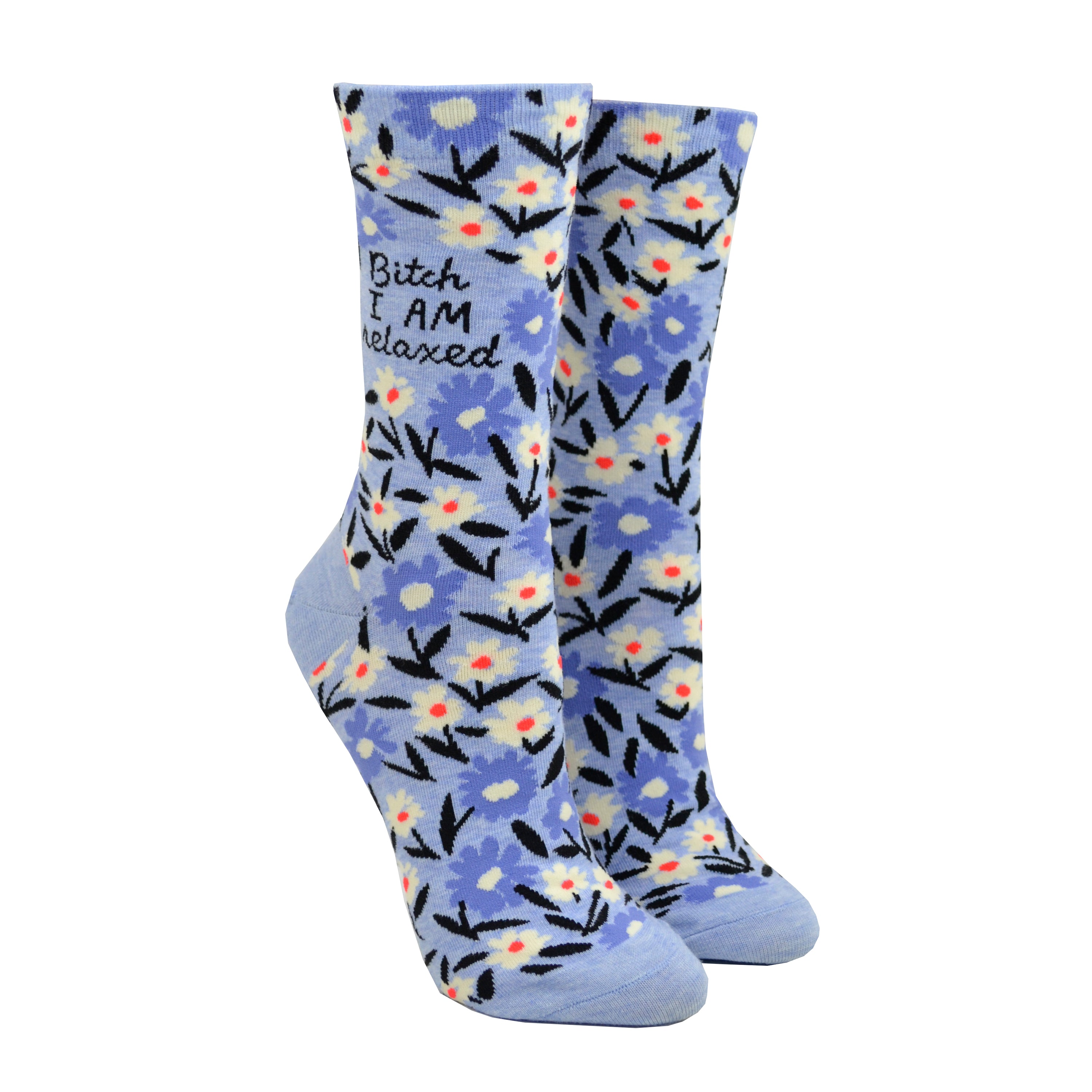 Shown on a leg form, a pair of Blue Q blue cotton women’s crew socks with blue and white floral pattern and “Bitch, I AM relaxed” text