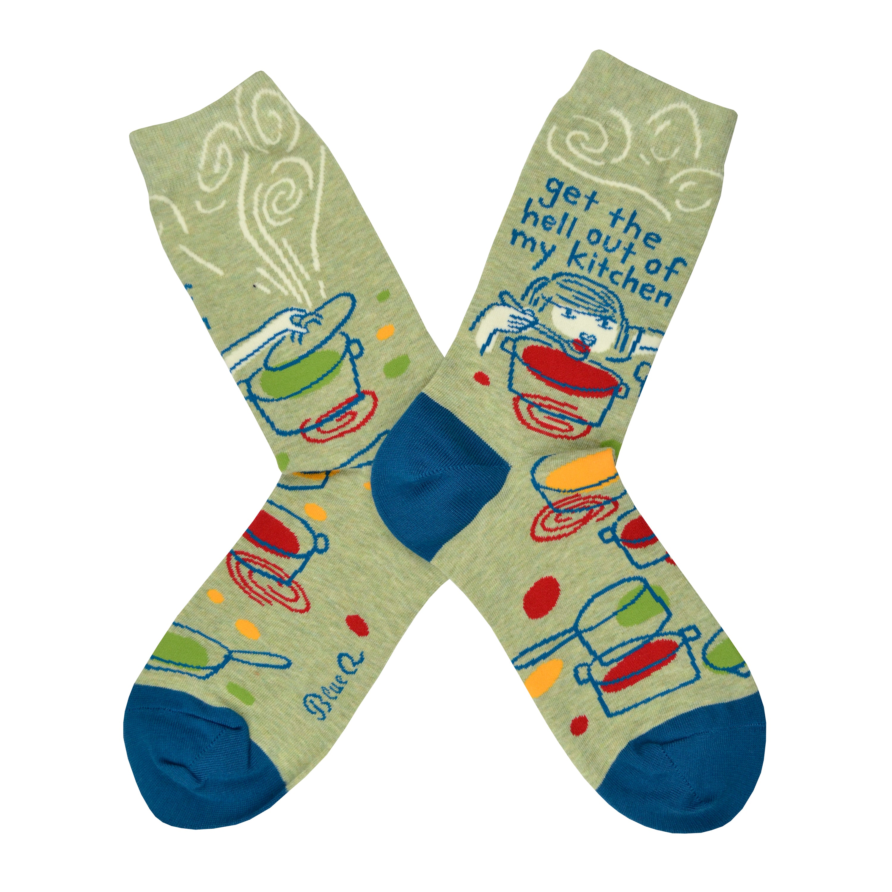 Shown in a flatlay, a pair of women's Blue Q cotton crew socks in olive green with a blue heel and toe. These socks feature a cartoon women over a pot with a spoon and the phrase, 
