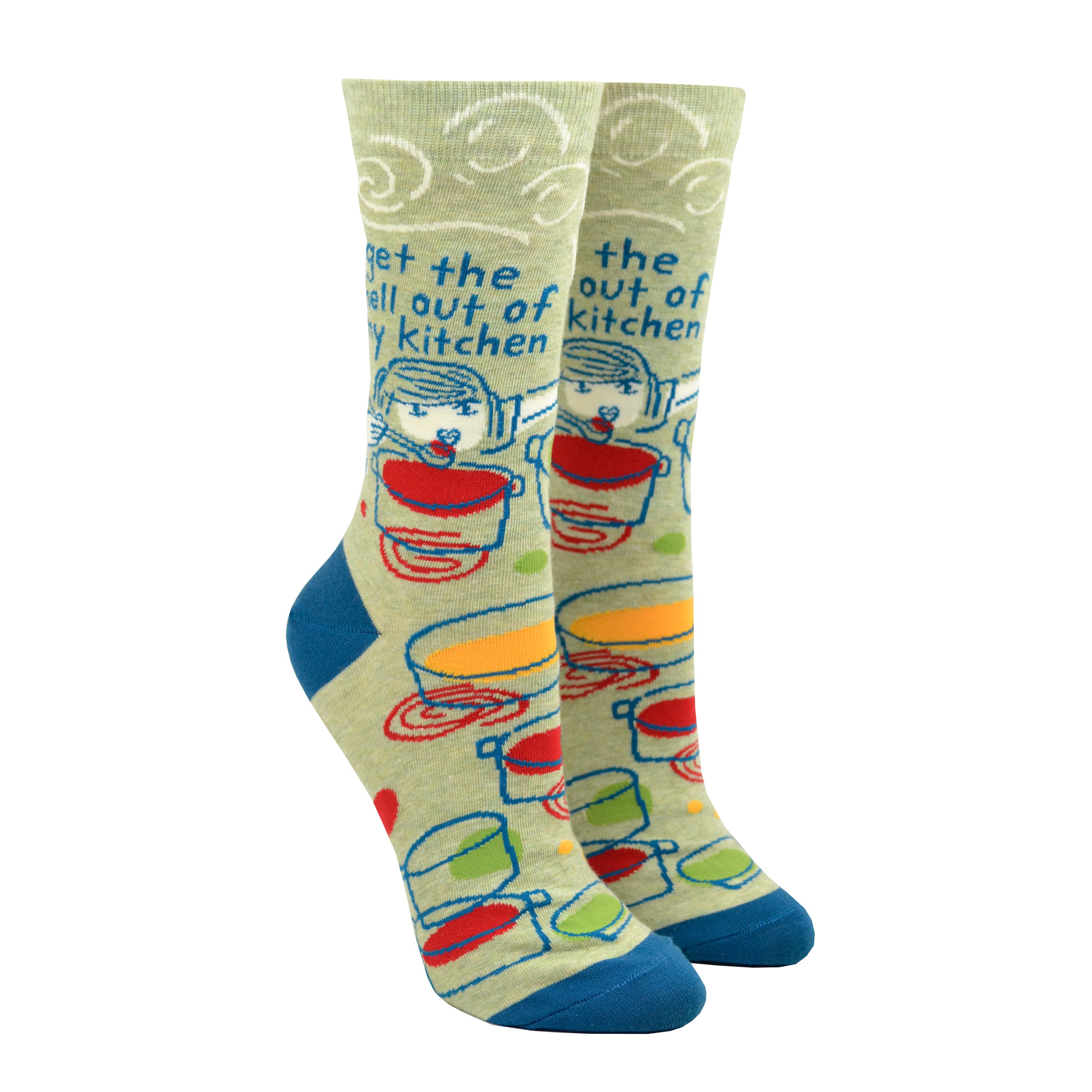 Shown on leg forms, a pair of women's Blue Q cotton crew socks in olive green with a blue heel and toe. These socks feature a cartoon women over a pot with a spoon and the phrase, 