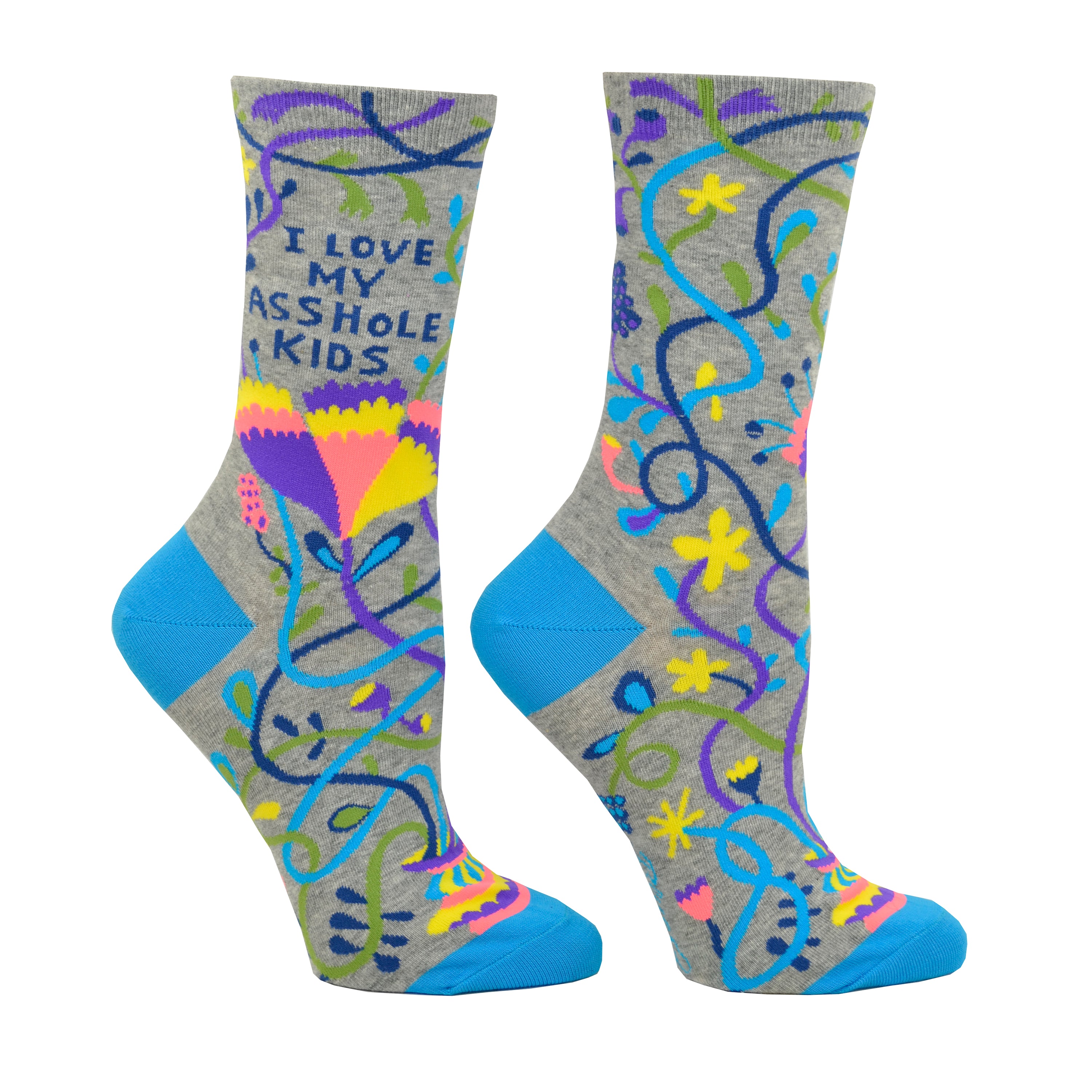 Shown on leg forms, a pair of women's Blue Q brand combed cotton crew sock in grey with a teal heel and toe. The socks feature an abstract floral design in yellow, purple, orange, and teal with the words, 