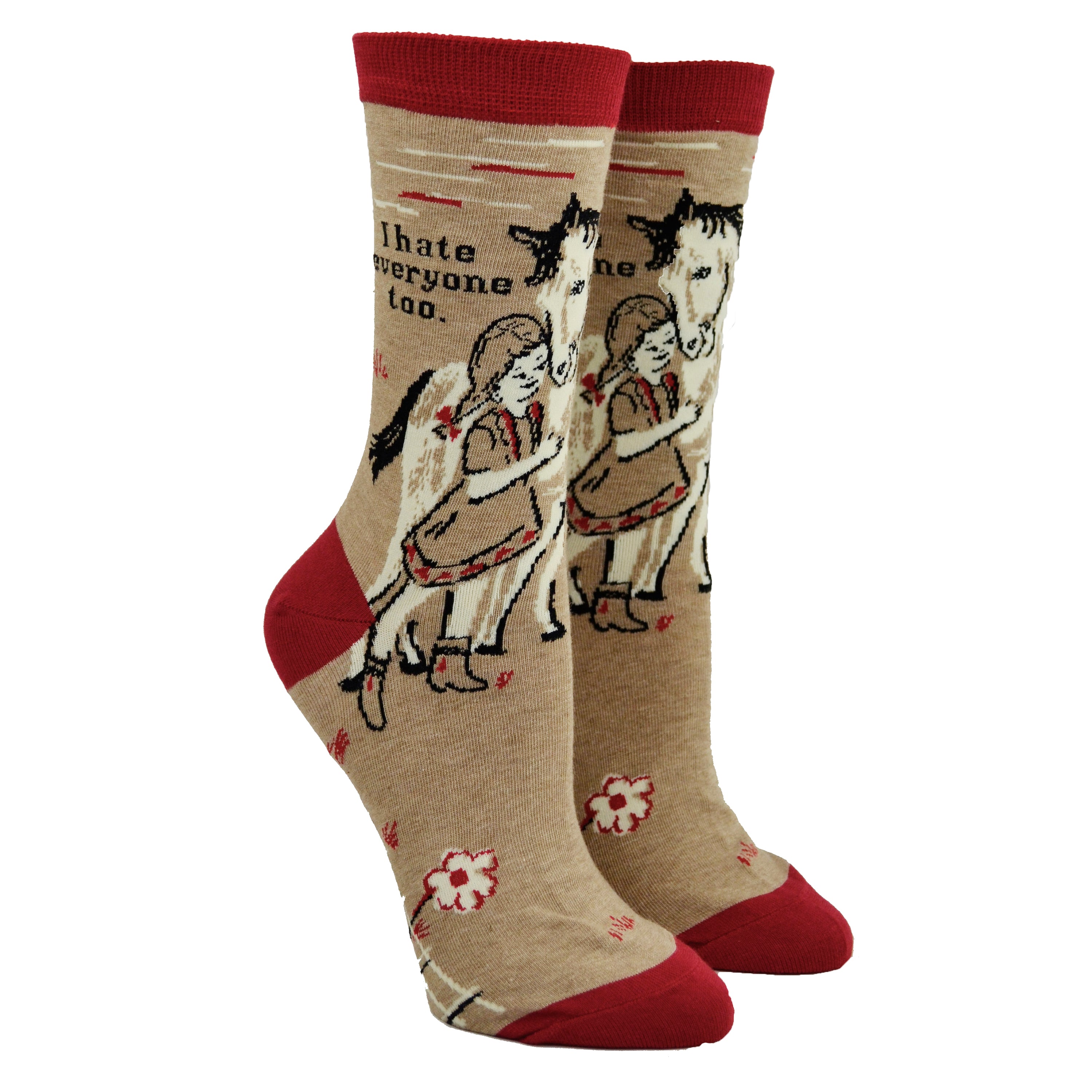 Shown on leg forms, a pair of women's Blue Q brand combed cotton socks in brown with a red heel, toe, and cuff. The leg of the sock features a little girl with a horse with the phrase, 