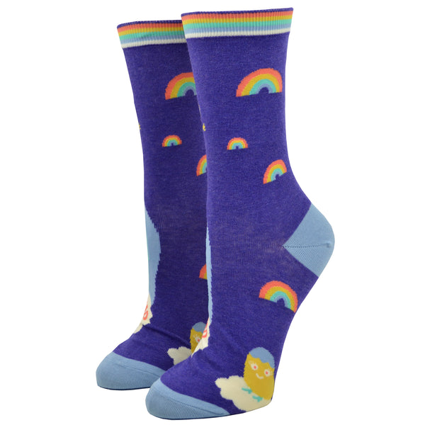 Small rainbows cover the reverse side of this shitting rainbows blue Q purple cotton crew sock for women. 