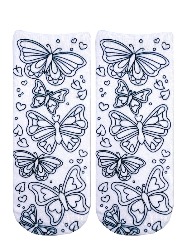flatlay of white socks with black line drawings of different sizes of butterflies and heart shapes