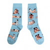 Shown in a flatlay, a pair of women's CouCou Suzette cotton crew socks in light blue with gay male lovers engaging in varying Kama Sutra sex positions all over the socks.