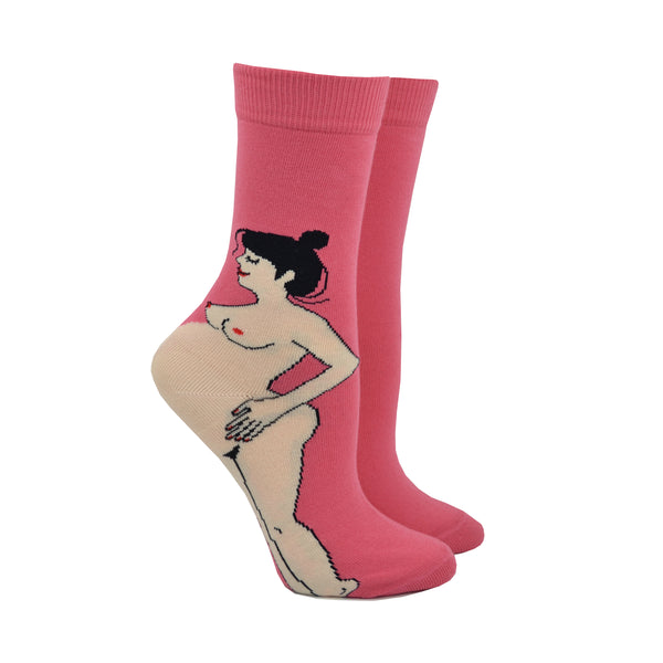 Shown on leg forms, bright pink CouCou Suzette socks with a brunette, naked, caucasian, pregnant woman. The woman's belly makes the ankle of the sock.