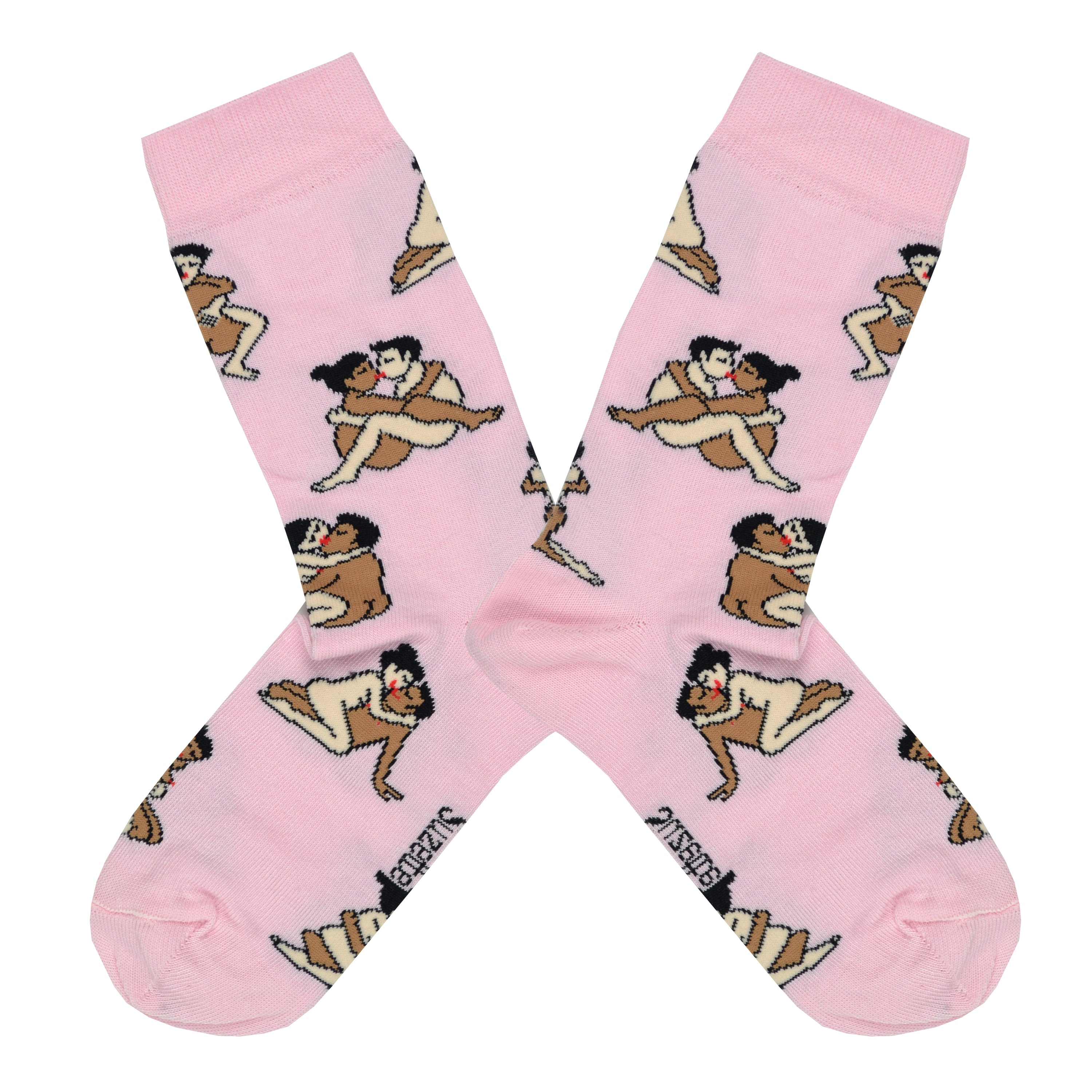Shown in a flatlay, a pair of light pink socks that show an interracial straight couple in various sexual positions from the Kama Sutra all over the sock. 