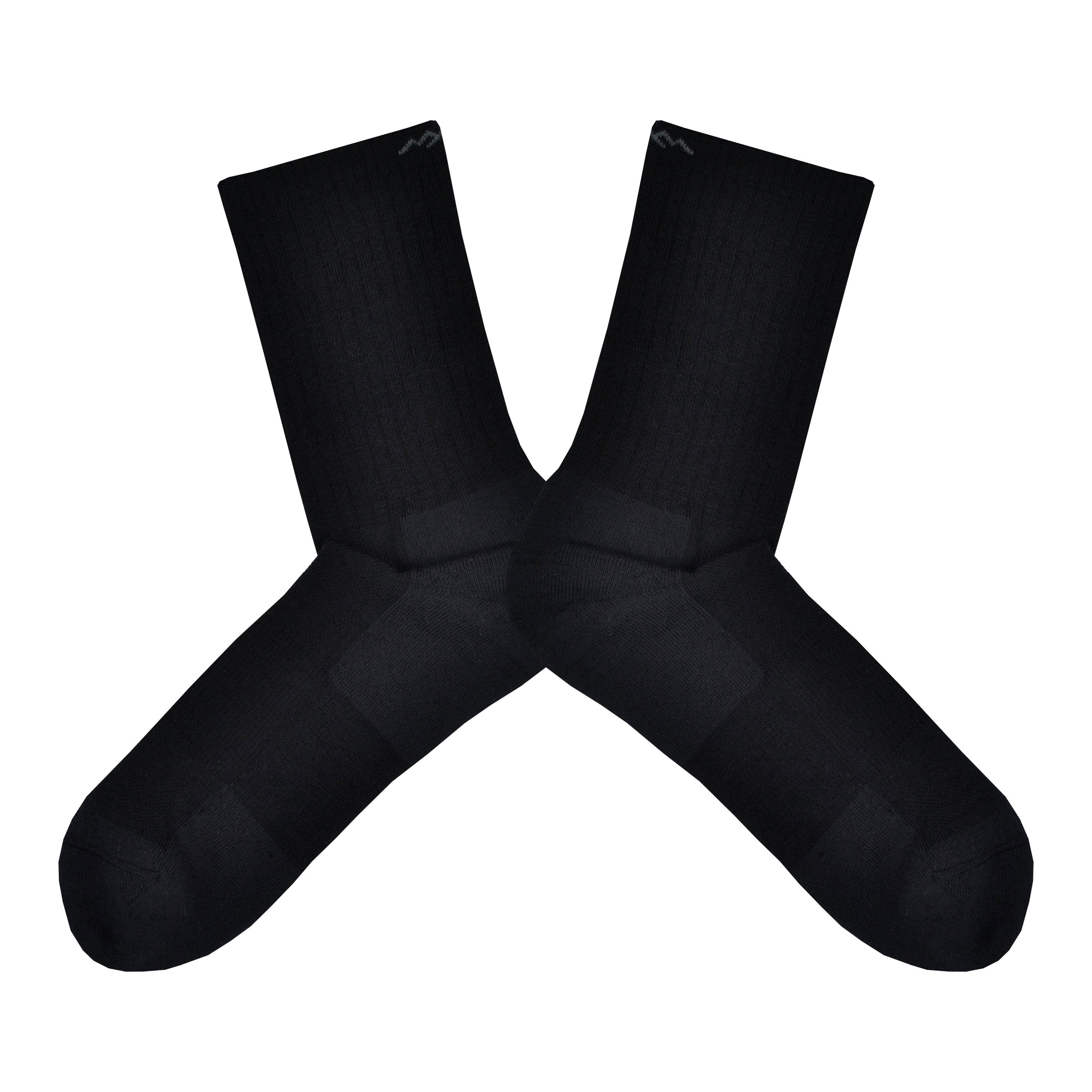 Shown in a flatlay, a pair of men's Darn Tough black crew socks. These socks are Merino Wool and Nylon.