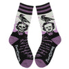 Shown in a flatlay, a pair of unisex crew socks in  purple, black, and, gray. The ankle and heel of the socks are purple and the cuff is purple and black stripped. The leg of the socks depicts famous poet, Edgar Allan Poe with a raven on his head and the other side of the sock Edgar with a skull for a face with a raven on his head. The foot of the sock is black with purple script. 