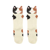 Shown in a flatlay, a pair of Foot traffic brand 3D calico cat socks. These tan socks feature a calico cat print and a 3D cat face and ears on the cuff. 