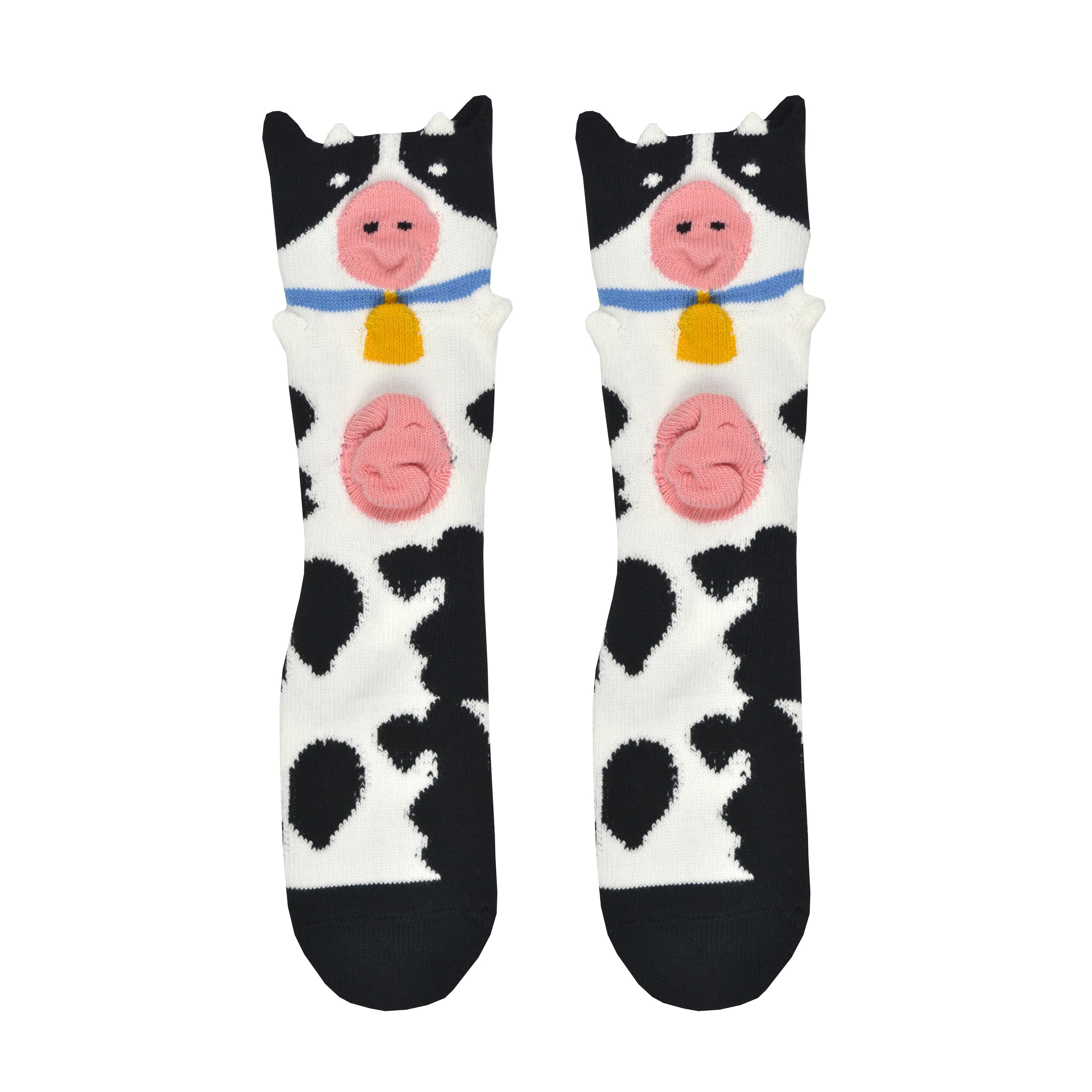Shown in a flatlay, a pair of Foot Traffic, black and white cotton women's crew socks with three dimensional pattern of cute cow wearing a bell