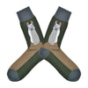 Shown in a flatlay, a pair of Foot Traffic green cotton men's crew socks with llama and brown foot