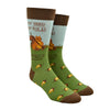Shown on a foot form, a pair of Foot Traffic cotton men's crew socks with brown cuff/heel/toe, scattered acorns, sassy squirrel and text “My Yard, My Rules, My Nuts!”