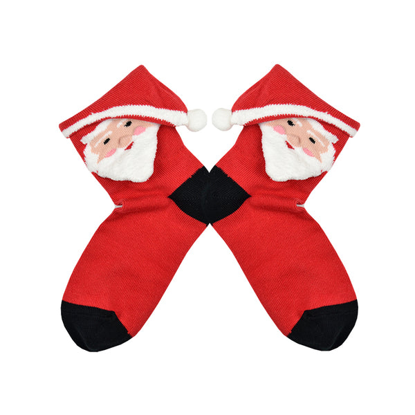 Shown in a flatlay, a childrens ages 7-10 size 3D santa sock. This sock is red with a black heel and toe and a 3D santa face with a triangle folded cuff as his hat.