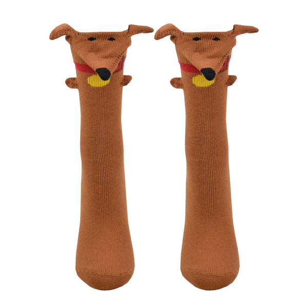 Shown on a foot mold from a different angle, a pair of Foot Traffic, brown cotton women's crew socks with three dimensional pattern of cute brown dachshund dog