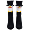 Shown on a foot mold from a different angle, a pair of Foot Traffic, black and white cotton women's crew socks with three dimensional pattern of cute penguin
