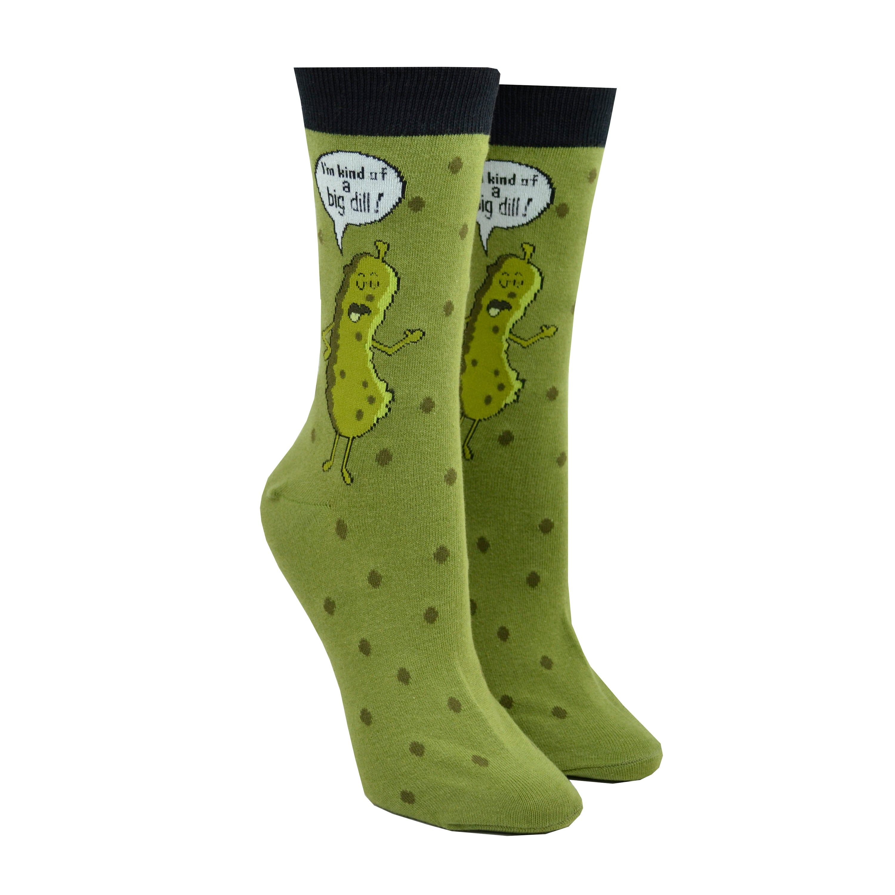 Shown on a leg form, these green cotton funny women's crew socks with a black cuff by the brand Foot Traffic have a picture of a talking dill pickle on them and a word bubble that says 