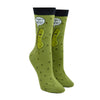 Shown on a leg form, these green cotton funny women's crew socks with a black cuff by the brand Foot Traffic have a picture of a talking dill pickle on them and a word bubble that says "I'm kind of a big dill".