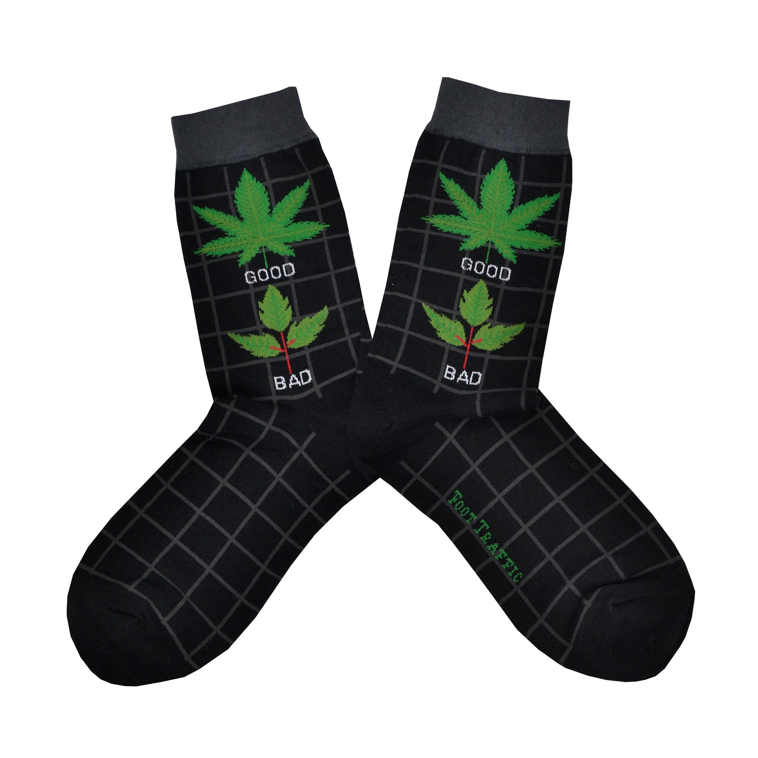 Shown in a flatlay, a pair of women's Foot Traffic cotton crew socks in black with a grey cuff and a grey grid pattern. The leg of the sock has a marijuana leaf with the word 