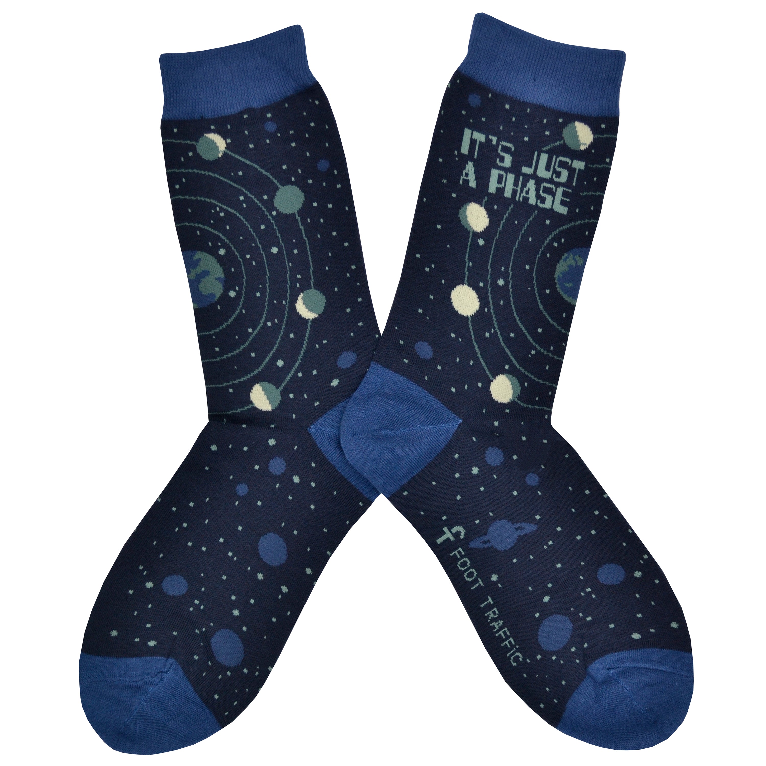 These blue cotton women's crew socks by the brand Foot Traffic feature small blue outlines of the planets  on the leg and foot and rings around the earth with the moon revolving in all its phases. The words 