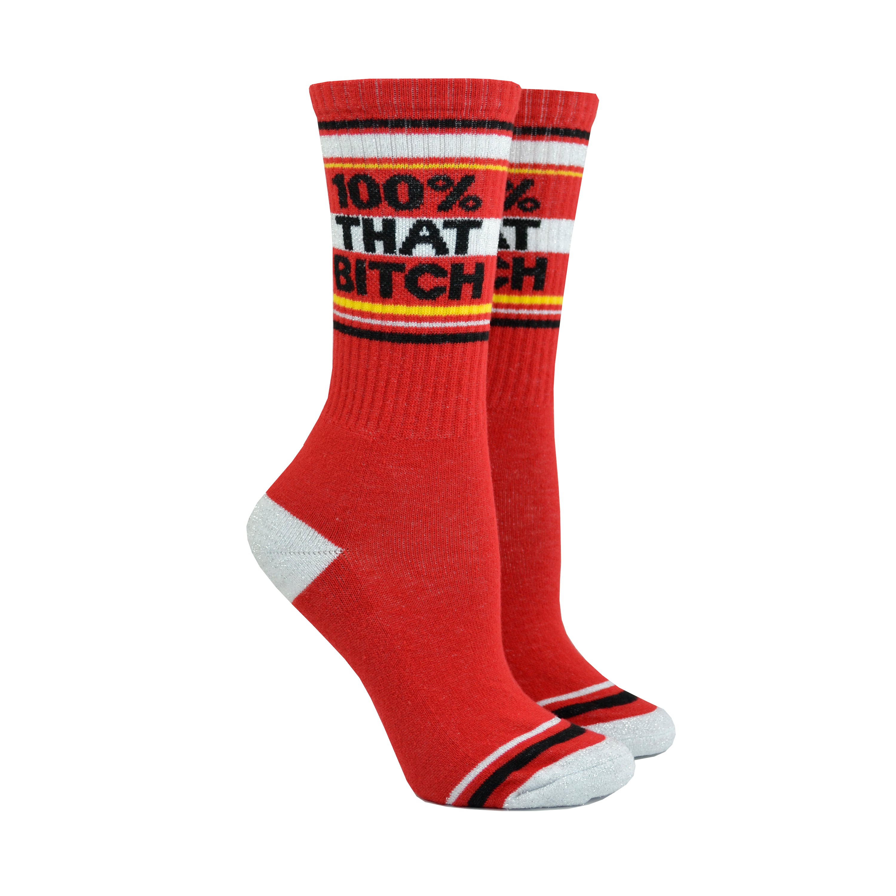 Shown on leg forms, a pair of cotton crew length unisex Gumball Poodle brand socks in red with a sparkly silver toe and heel. The leg of the sock features, black, sparkly silver, and yellow stripes with the phrase, 