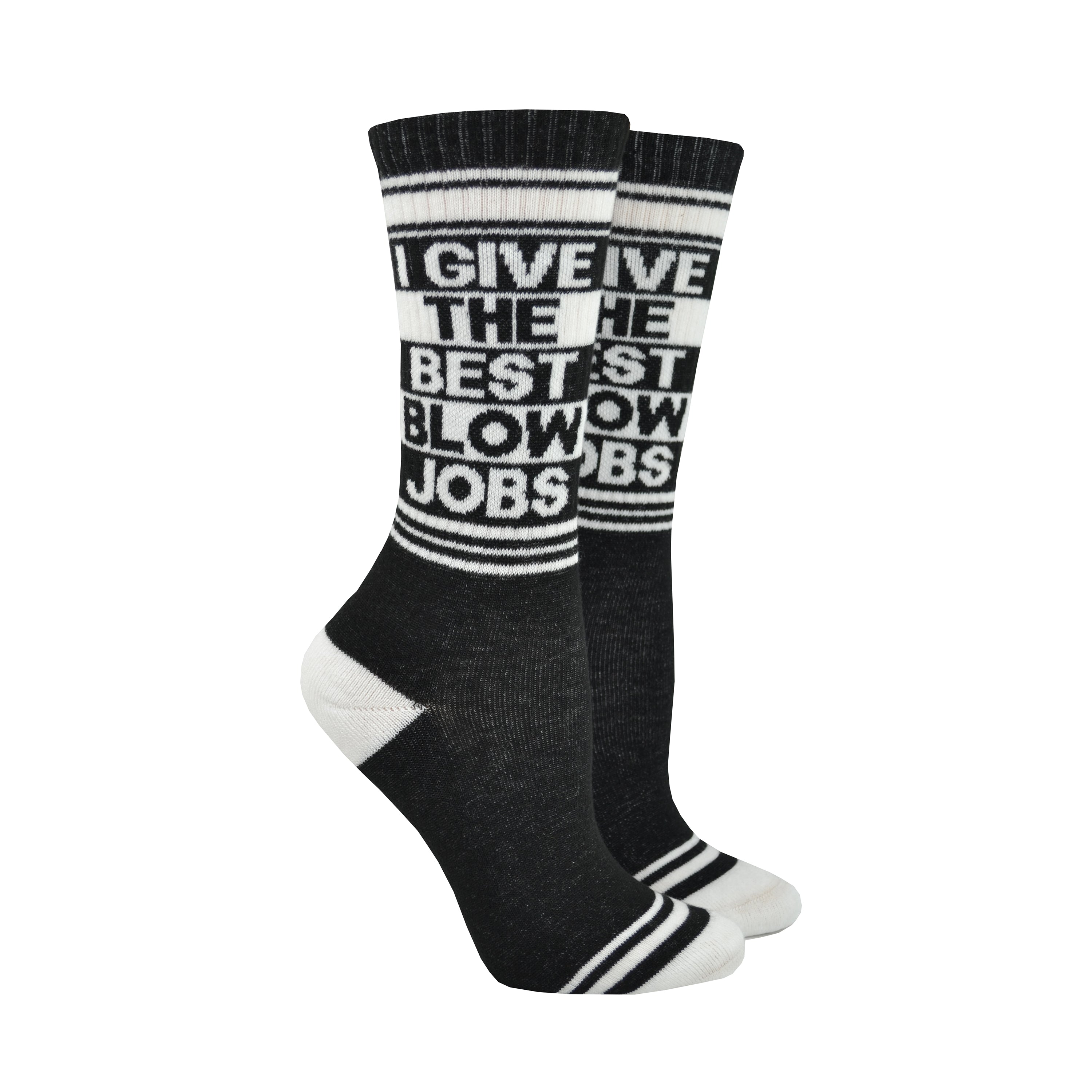Shown on leg forms, a pair of black cotton Gumball Poodle brand unisex crew socks with white striped cuff/heel/toe. These socks feature the phrase, 