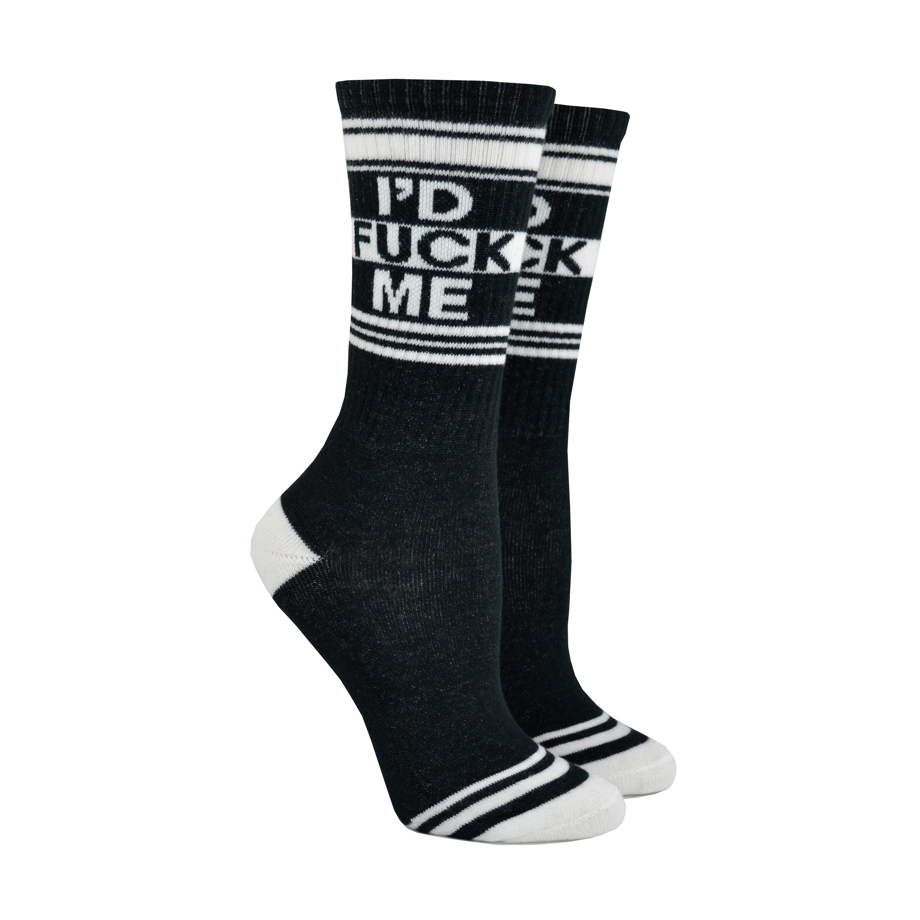 Shown on leg forms, a pair of black cotton Gumball Poodle brand unisex crew socks with black and white striped heel/toe/cuff featuring the words, 