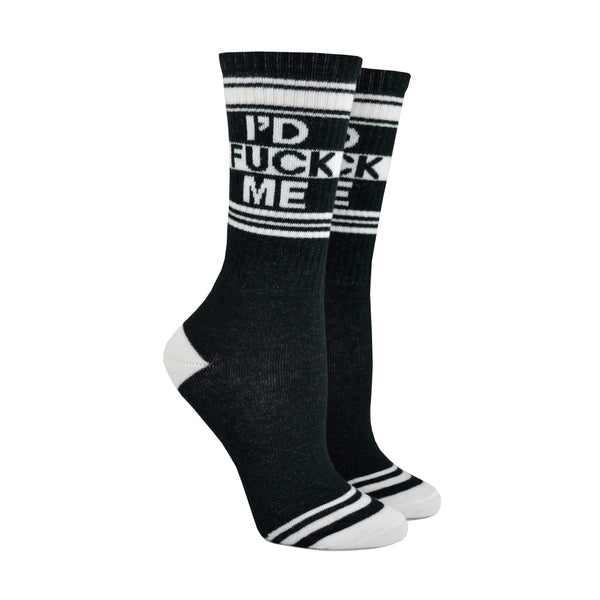 Shown on leg forms, a pair of black cotton Gumball Poodle brand unisex crew socks with black and white striped heel/toe/cuff featuring the words, "I'D FUCK ME" on the leg.