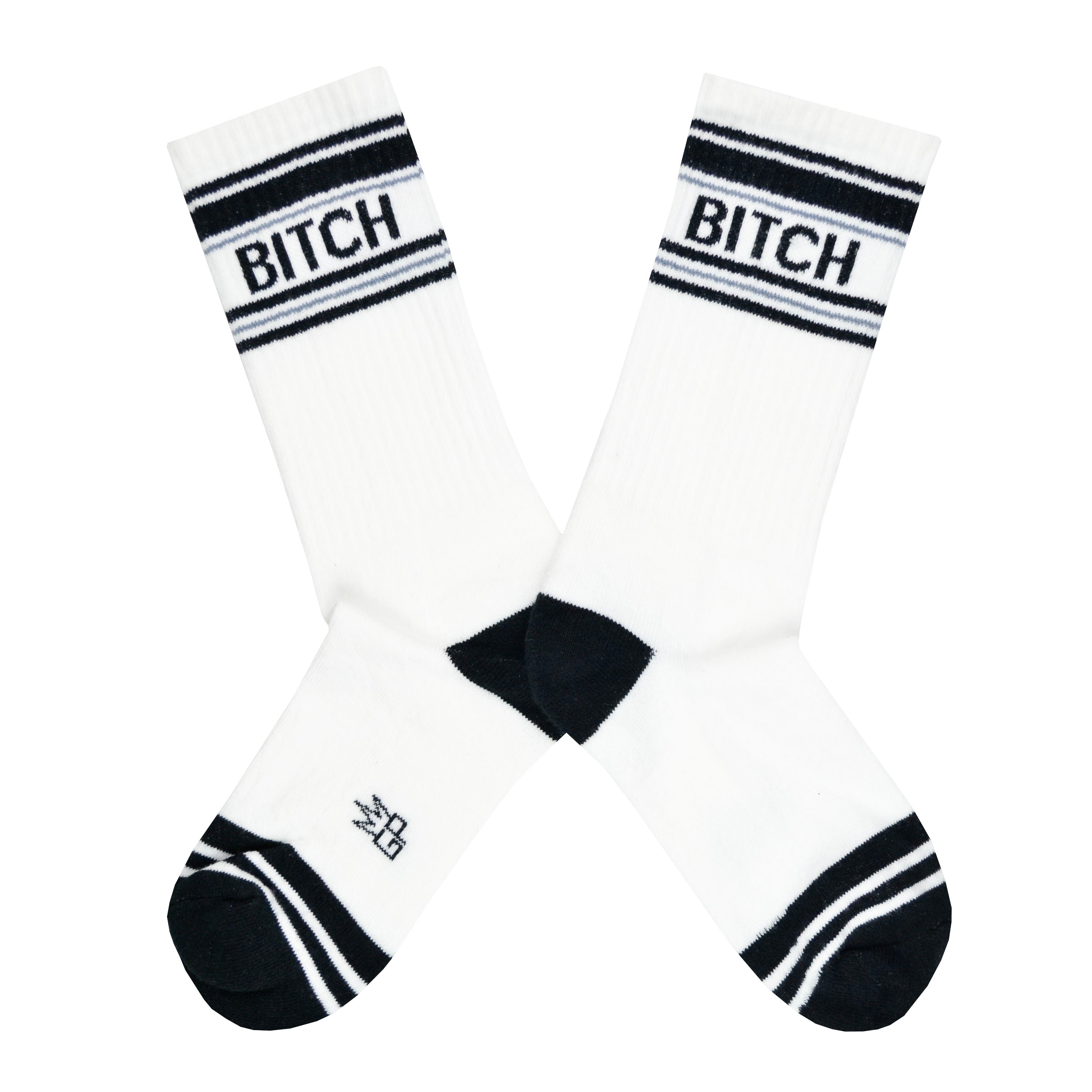 These white cotton unisex crew socks with a black toe and striped cuff by the brand Gumball Poodle feature the words 