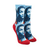 Shown on a leg form, a pair of Good Luck Socks’ polyester-cotton women’s crew socks with portrait of Alexandria Ocasio-Cortez in shades of red, white and blue