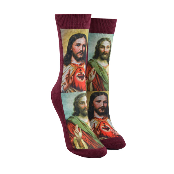 Shown on small leg forms, a pair of polyester and cotton Good Luck Sock brand maroon socks with two iconic depictions of Jesus Christ.