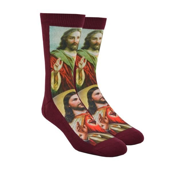 Shown on large leg forms, a pair of polyester and cotton Good Luck Sock brand maroon socks with two iconic depictions of Jesus Christ.