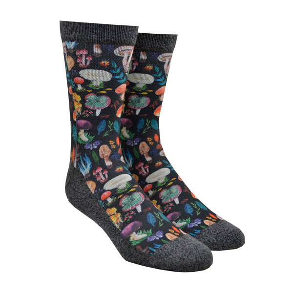 Shown on a leg form, these multi-colored men's polyester crew socks with a black toe and cuff by the brand Good Luck Socks feature all different types of small mushrooms in different colors covering the leg and foot.