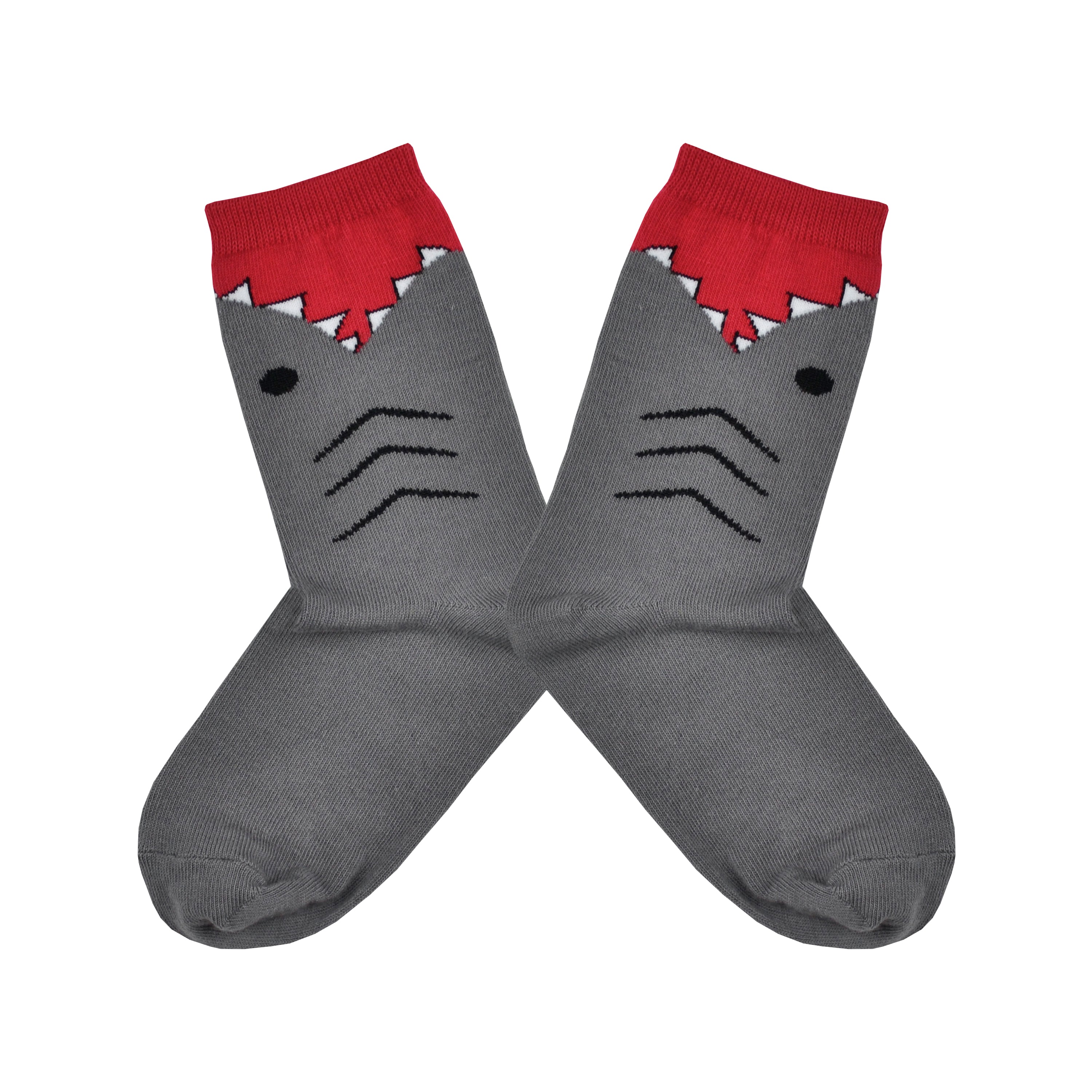 Shown in a flatlay, a pair of K.Bell brand grey cotton kids crew socks. The foot and heel of the sock are grey with the top being red with the design of shark teeth around it.