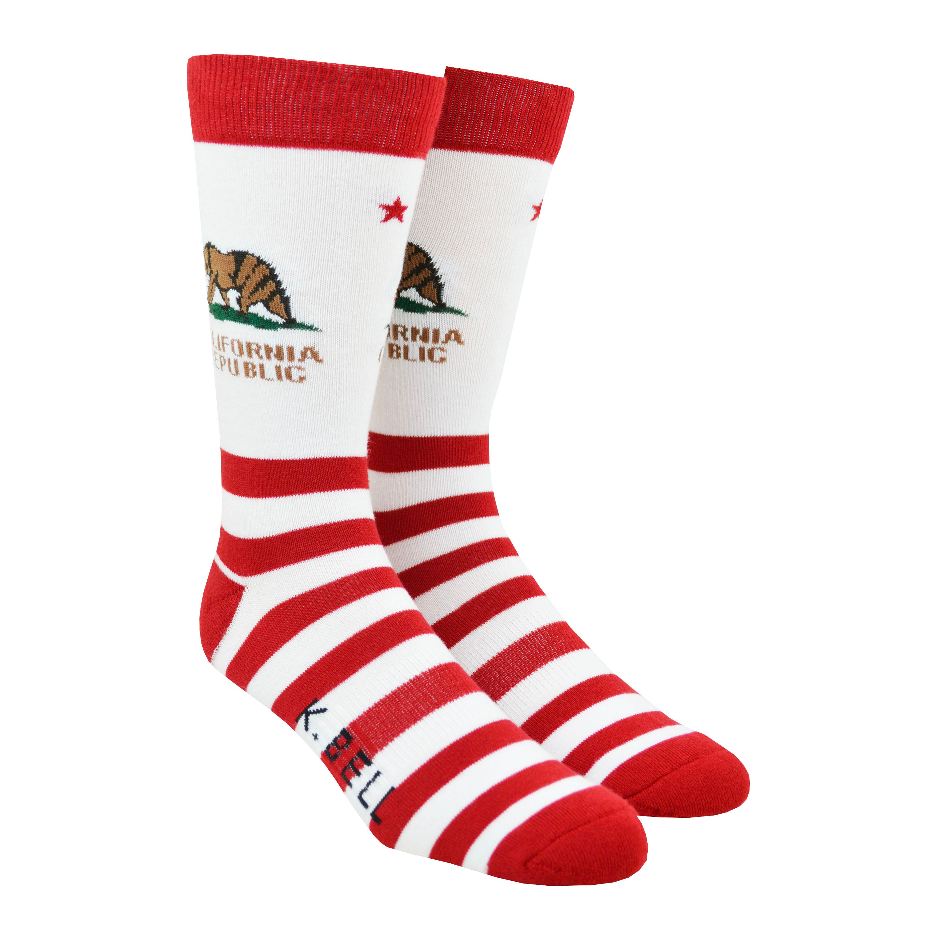 Shown on a leg form, a pair of K. Bell’s white cotton men’s crew socks with red stripes/cuff/heel/toe and California flag print