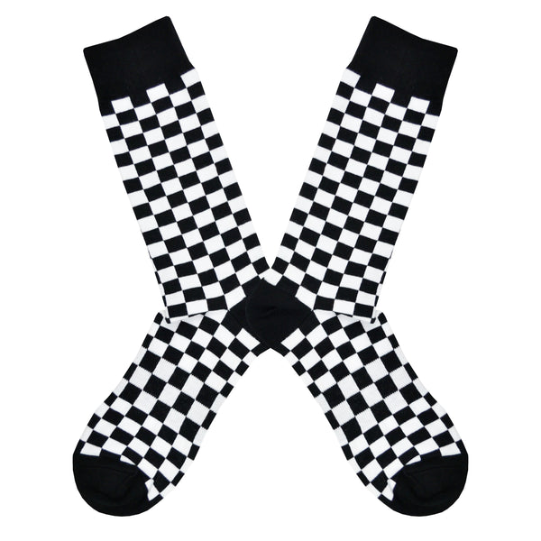 Shown in a flatlay, a pair of K. Bell’s cotton men’s crew socks with black and white ska checkerboard pattern