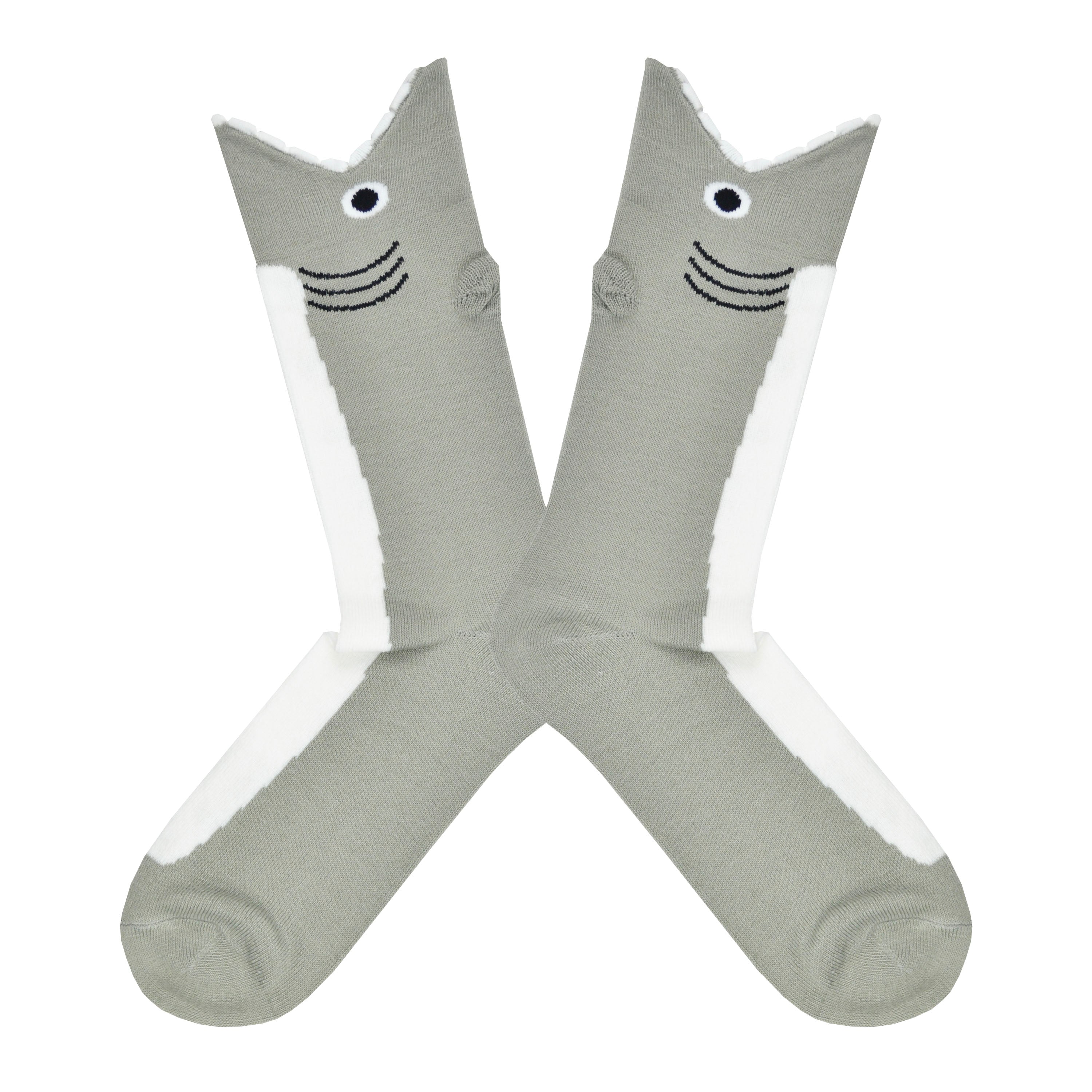 Shown in a flatlay, a pair of K.Bell brand men's acrylic crew socks in grey and white. These socks feature a white front and are shaped like a shark. The cuff is the sharks mouth with a frilled edge to mimic the sharks teeth around your leg.