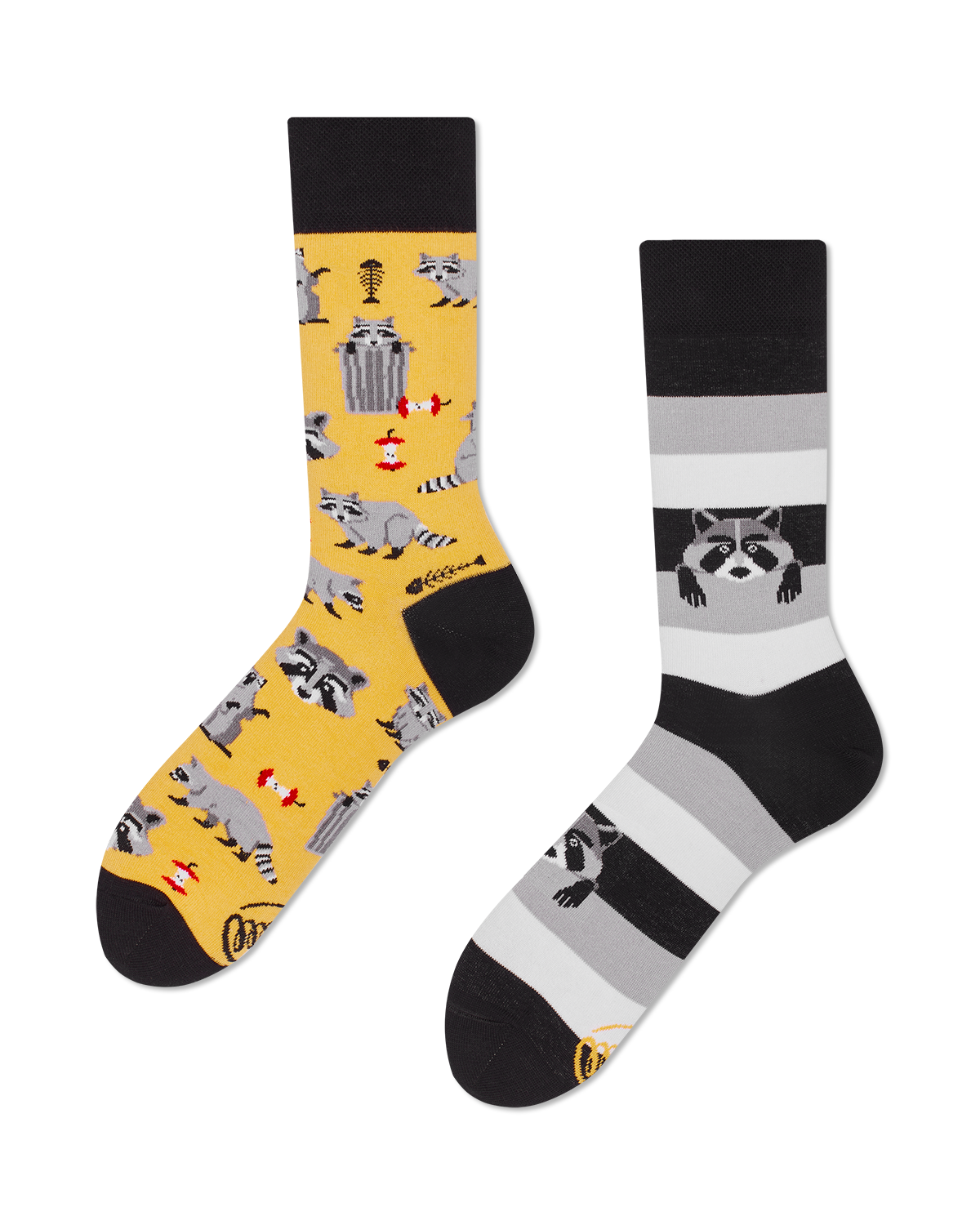 flatlay of a pair of mistmatched crew length socks, one yellow with a pattern of raccoons, trash cans, apple cores, fish bones and raccoon faces, the other shaes of black and gray stripes with a couple raccoons appearing to crawl out of the stripes