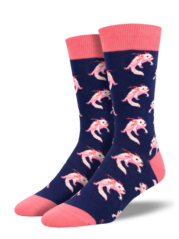 a pair of mens socks with a navy background featuring a motif of pink axolotls smiling with happy expressions and a pink toe, heel and cuff